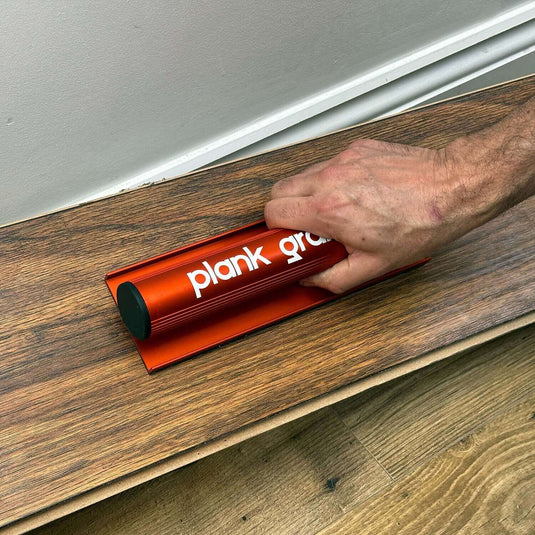 Floor Fix Pro Plank Grabber Plank Grabber is a tool for fixing gaps in floating floors. It features a "Magic Grip Strip" that sticks to the plank you want to move using nano-suction and without leaving any sticky residue. Plank Grabber can be used to fix